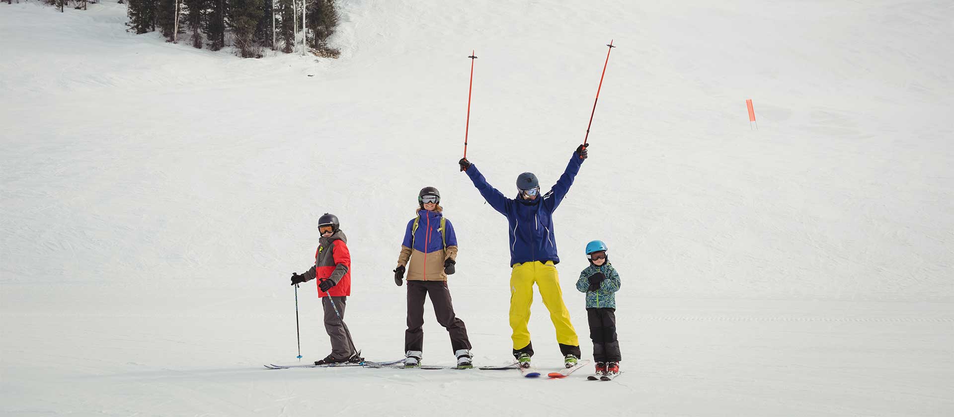 family-having-fun-while-skiing